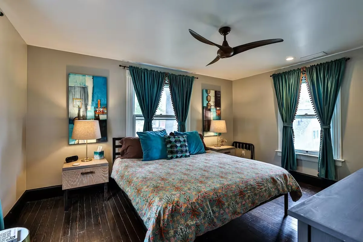 Queen bedroom with garden-facing windows