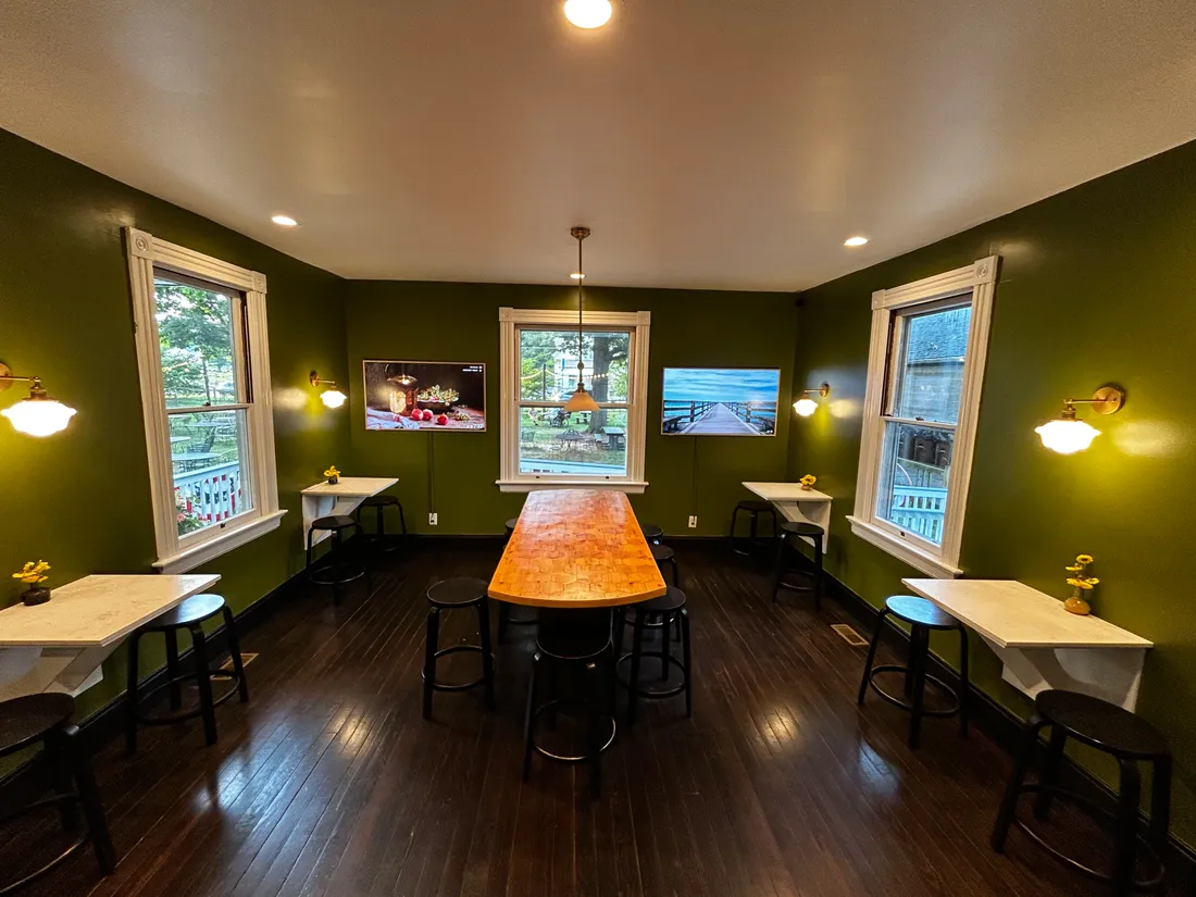 The long communal table set under the windows