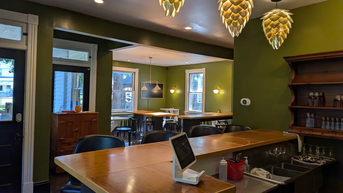 Bar seating with a view through to the back dining room