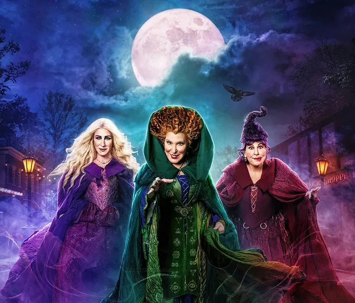The three Sanderson sisters from Hocus Pocus 2 beneath a full moon